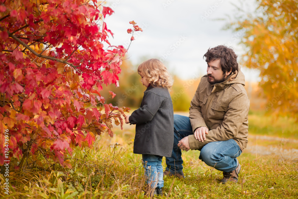 Father and daughter walking together, autumn day. Father and daughter walking together, autumn day.