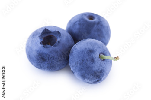 Three blueberries closeup isolated on white