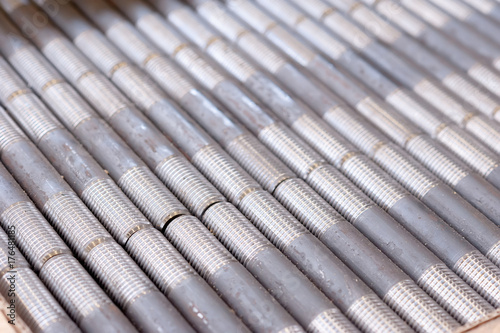 tubes with threaded threads. in production. finished parts in a row