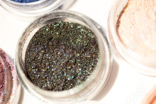 Cosmetics. Pigments for make-up, eyes, lips, face and body. Brilliant radiant, scattered multicolored powders.