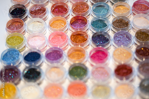 Cosmetics. Pigments for make-up, eyes, lips, face and body. Brilliant radiant, scattered multicolored powders.