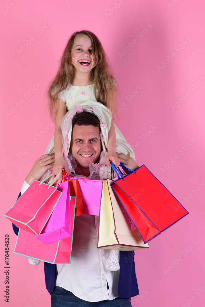 Schoolgirl and father do shopping and have fun. Shopping, presents