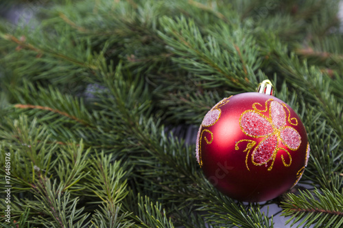 Christmas decorations on spruce branches.