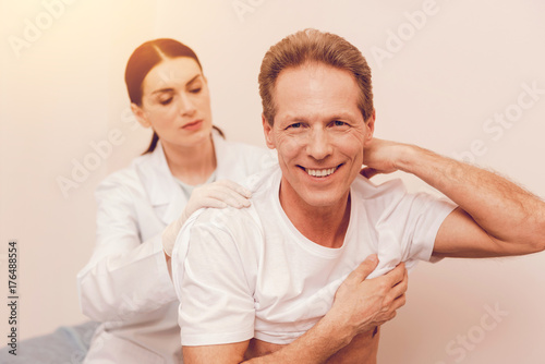 Smiling mature man vising his doctor
