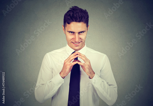 Sneaky scheming man trying to plot something