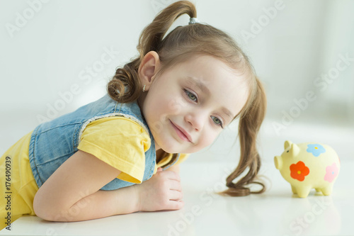 Child with a piggy bank 