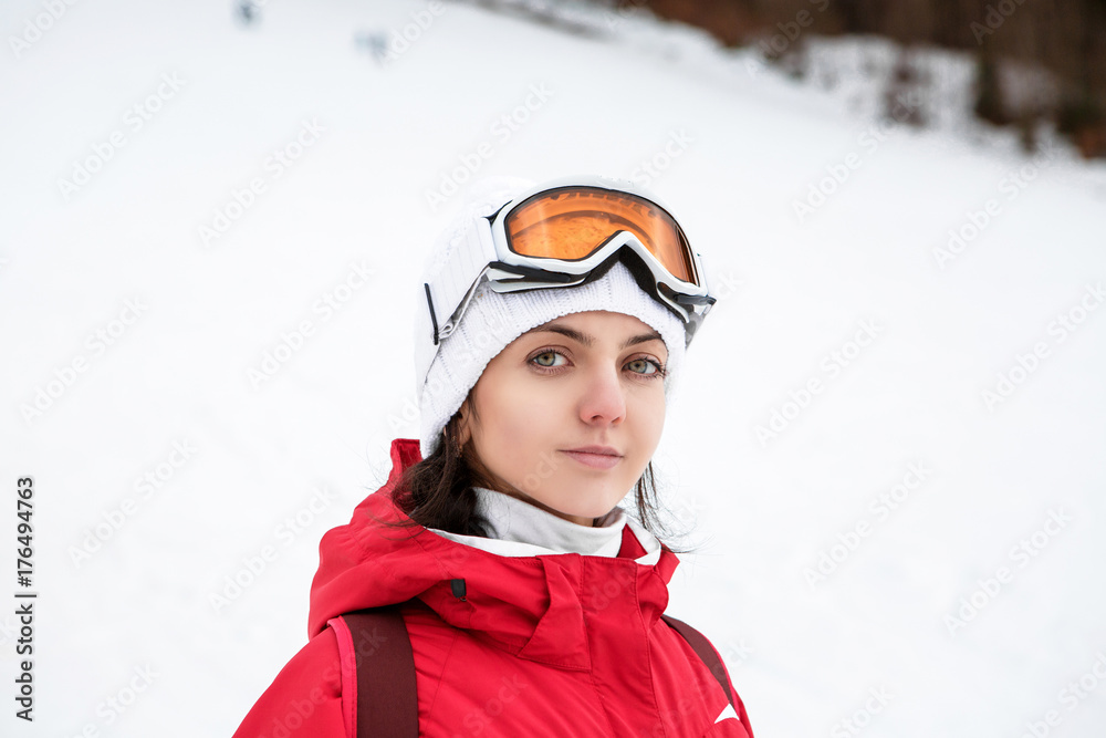 Portrait of a skier woman in ski goggles Portrait of a skier woman in ski goggles