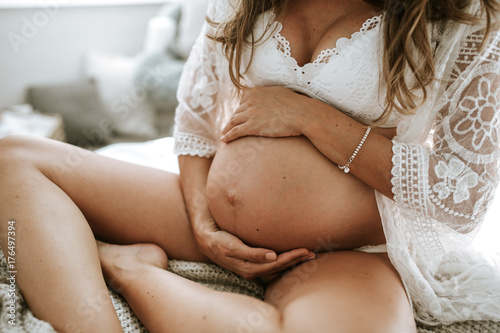 Woman holding Hands on Babybelly photo