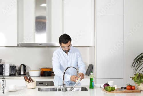 arab man washing dishes