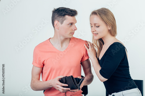Nerdy man is trying to hide money from his wife because she want to spend it all photo