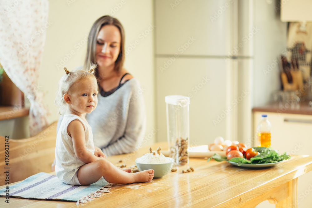 mother and kid preparing healthy food and having fun