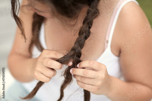 young woman fixing her hair