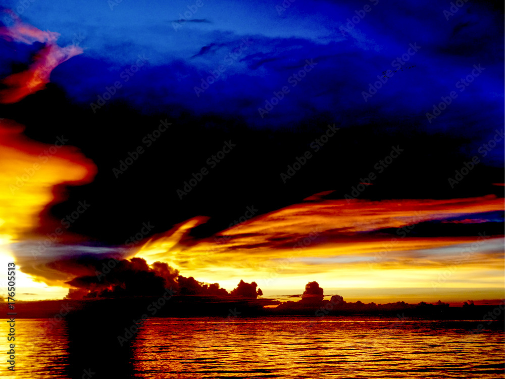 sunset sea ship on horizon line bird fly on night cloud