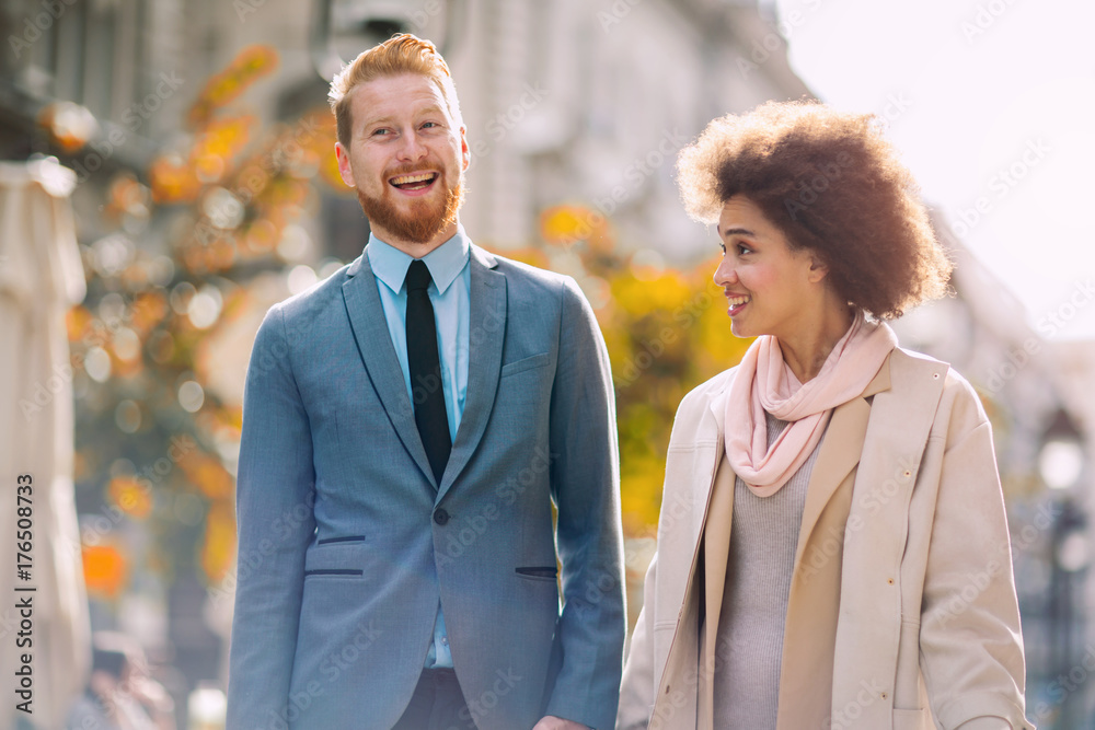Businesspeople commuting and walking in busy city together Businesspeople commuting and walking in busy city together