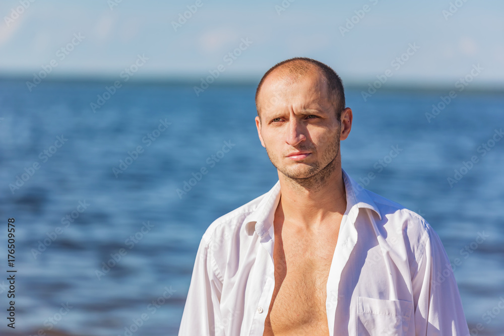 Portrait of a man in the background of the water