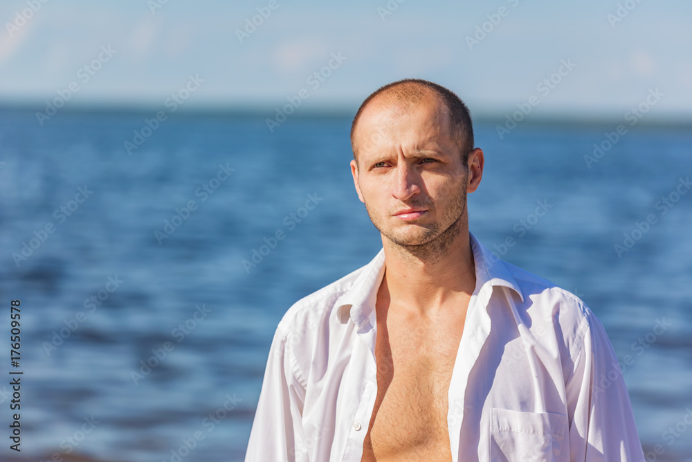 Portrait of a man in the background of the water Portrait of a man in the background of the water
