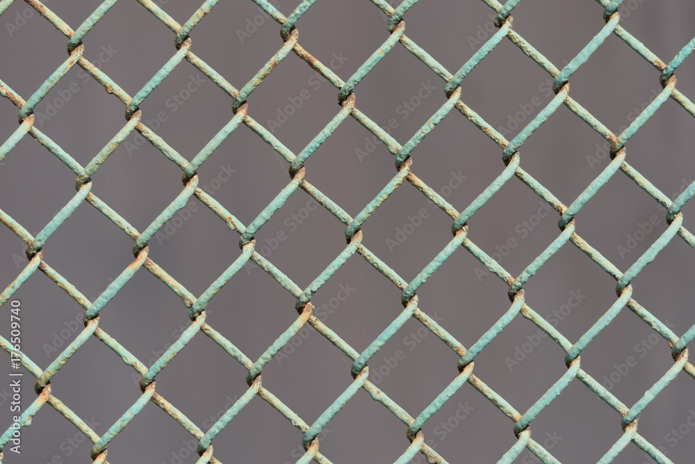 Naklejka premium old metal fence on a dark background.