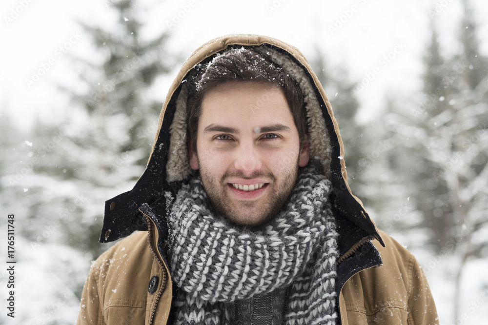 Portrait of smiling young man in winter Portrait of smiling young man in winter