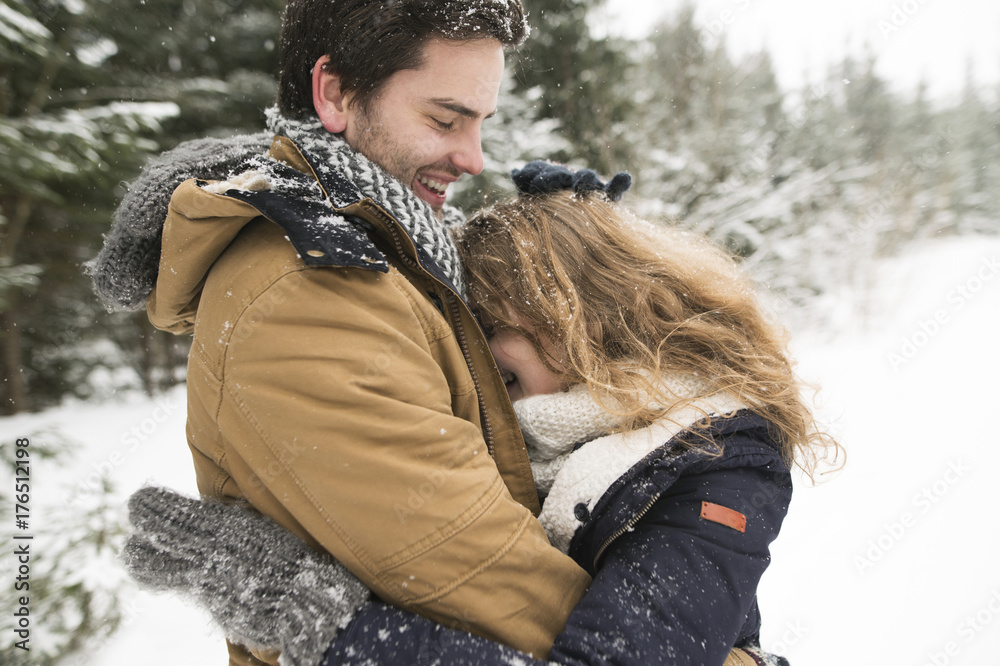 © Westend61 - Happy young couple having fun in snow-covered winter forest © Westend61 - Happy young couple having fun in snow-covered winter forest