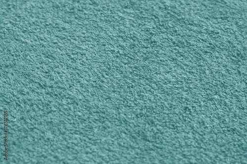 cyan color towel surface close-up with blur effect.