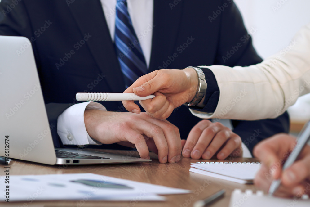 Fototapeta premium Group of business people or lawyers at meeting, hands close-up
