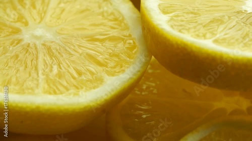 Lemon slices with mint leaf rotation background. Close-up of a delicious ripe lemon rotate and aromatic mint. Healthy food, cooking ingredient. UHD video footage. Ultra high definition 3840X2160