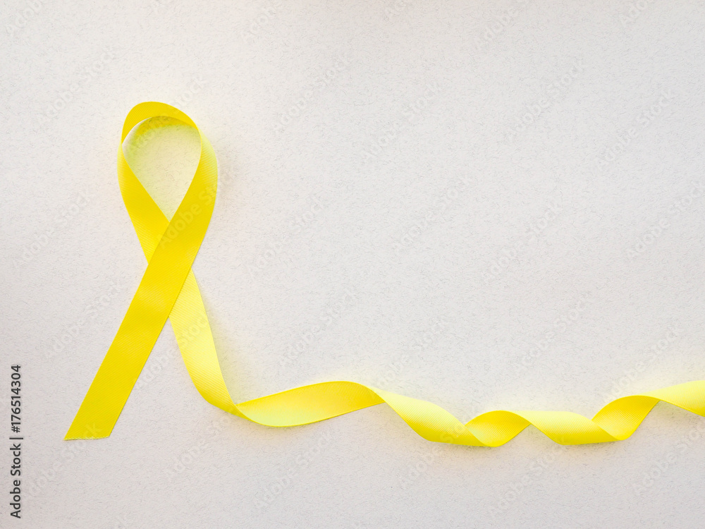 Yellow Ribbon On Light Background. Cancer Concept Stock Photo, Picture and  Royalty Free Image. Image 116011692.