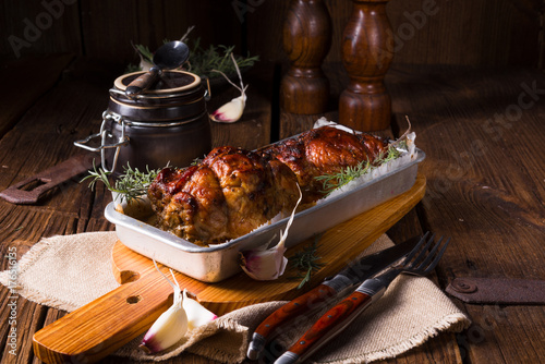 small Rolling roasts fully with dried fruit and bacon photo