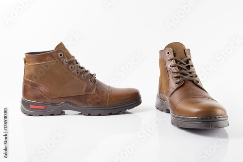 Male brown leather boot on white background  isolated product.