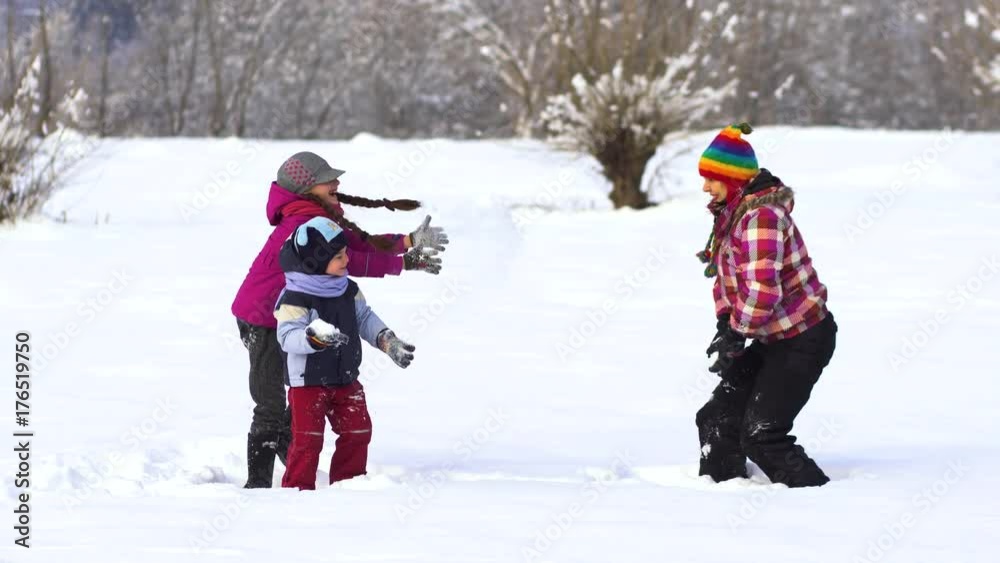 Happy family having fun playing in the snow. Happy family having fun playing in the snow.