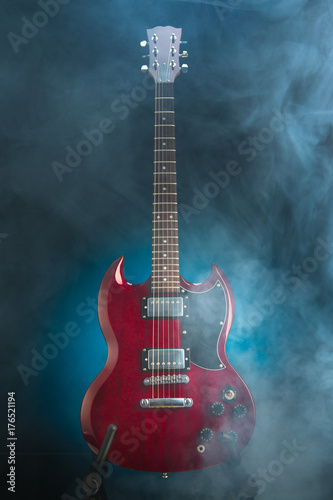 electric guitar in smoke, blue background