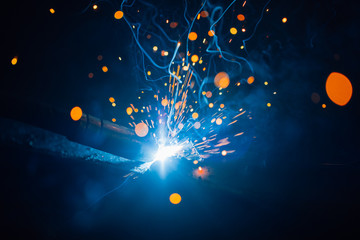 artistic welding sparks light, industrial background