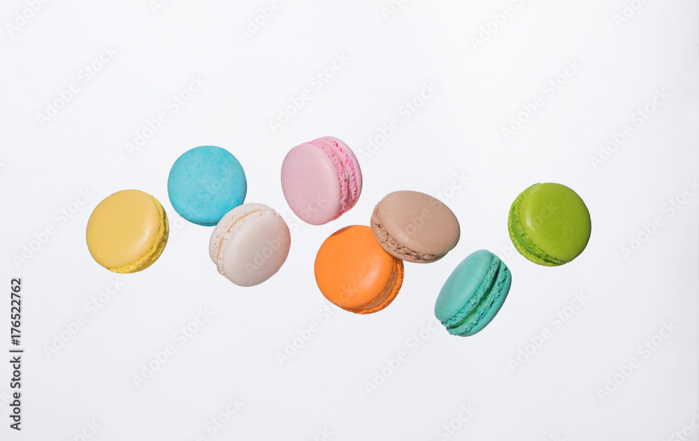 Colorful macarons cakes. Sweet french macaroons flying in motion. Colorful macarons cakes. Sweet french macaroons flying in motion.