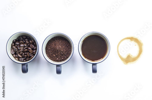 Three cups of difference stages of coffee preparation or the making of coffee drink and one of coffee stain isolated on white background
