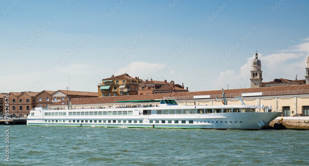 View of the beautiful architecture and yacht along canals in Venice, Italy