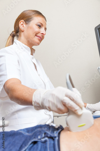 Female doctor making scan on patient