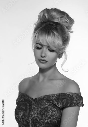 portrait of a beautiful blonde woman in retro dress 50-s style . monochrome black and white photo photo