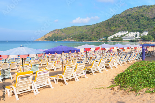 Beach chairs on the white sand beach and tropical sea in Phuket, Thailand © yotrakbutda