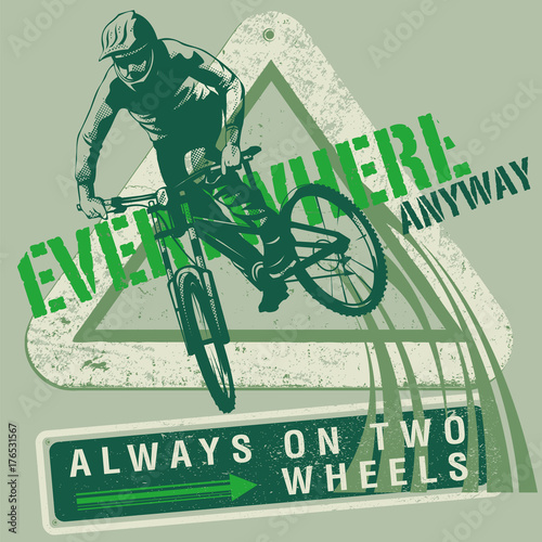 Cyclist on mountain bike on modified road sign