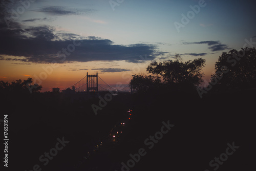 Bridge and street traffic at sunset photo