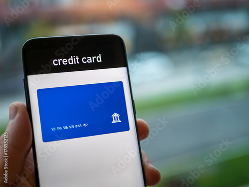 Credit card in mobile app. Smartphone concept.