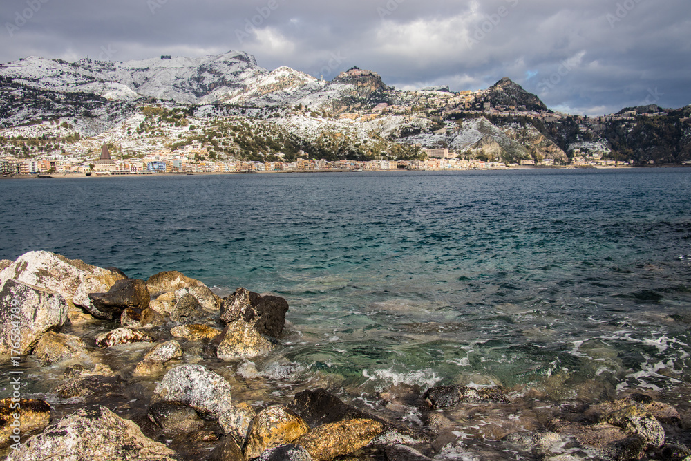 Landscape view of Taormina and Castelmola under the snow (GEN 2017), Sicily Italy