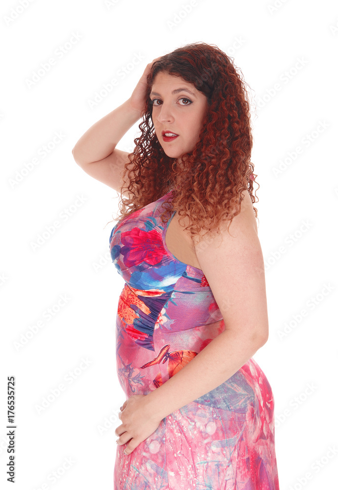 Beautiful woman in colorful dress standing in profile Beautiful woman in colorful dress standing in profile