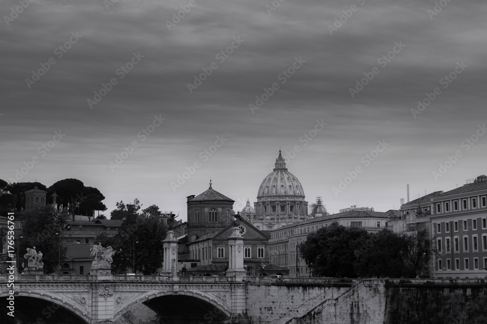 view of the bridge and the basilica of St. Peter in black and white with a sky-blue sky