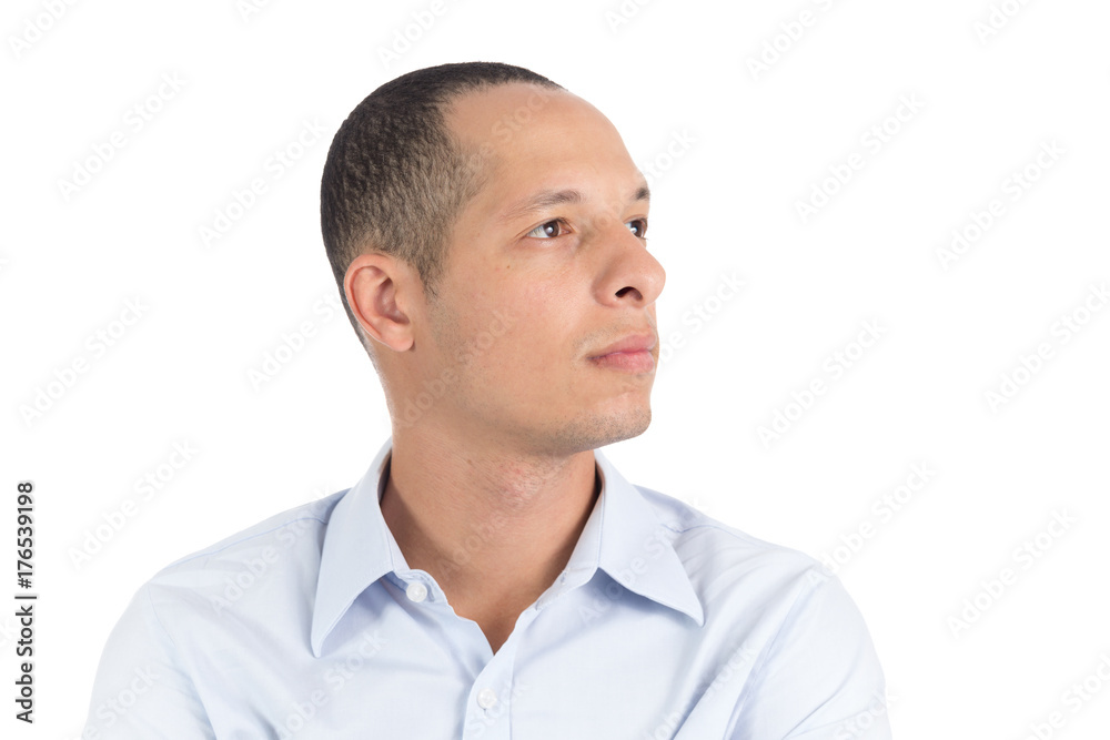 Young man is looking to the side. Profile face He is Latin. Isolated on white background. Young man is looking to the side. Profile face He is Latin. Isolated on white background.