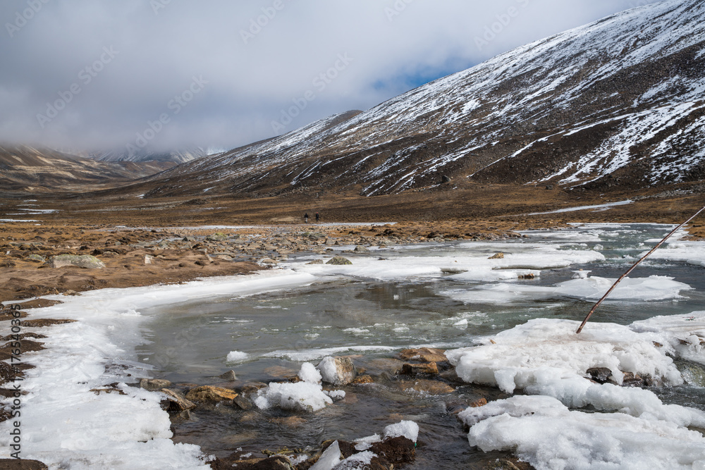 Snow flake beside River from snow ice melt on mountain Landscape view at Zero-Point, fog and mist weather day time Snow flake beside River from snow ice melt on mountain Landscape view at Zero-Point, fog and mist weather day time