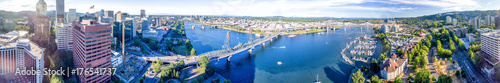 PORTLAND, OR - AUGUST 18, 2017: Aerial view of cityscape and Willamette River. Portland attracts 5 million tourists annually