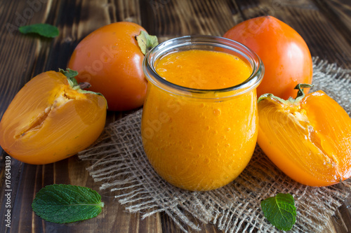 Puree with persimmon on the rustic background