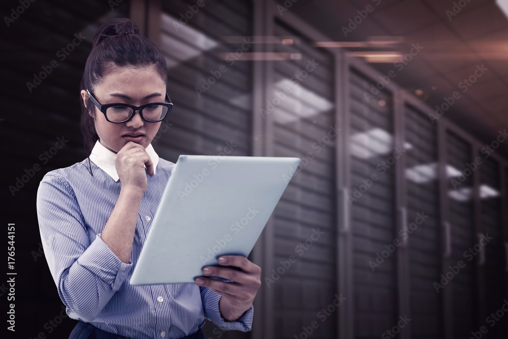 Composite image of asian businesswoman using tablet Composite image of asian businesswoman using tablet