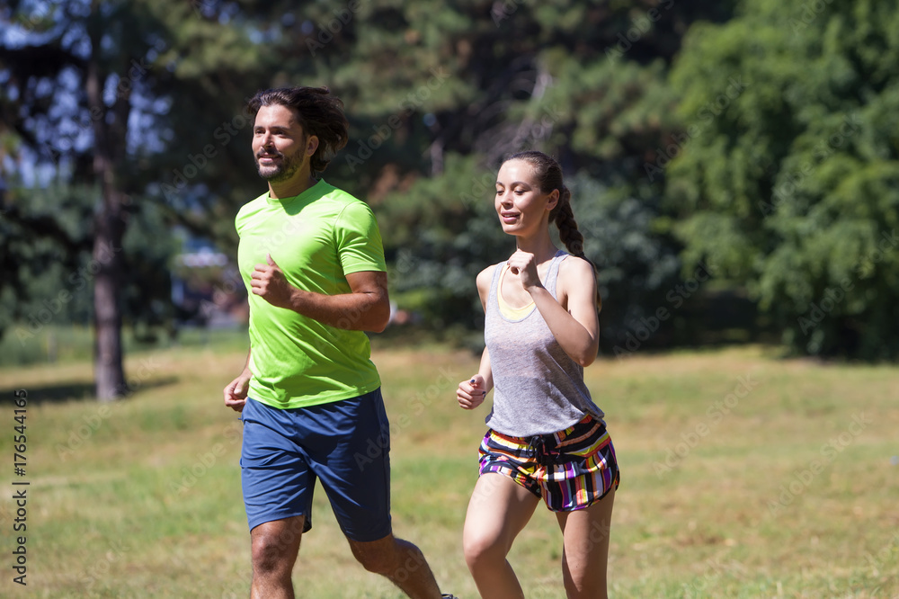 Healthy, fit and sportive couple running in park Healthy, fit and sportive couple running in park